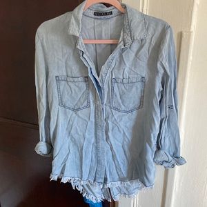 Barely work denim button up with fraying at the bottom